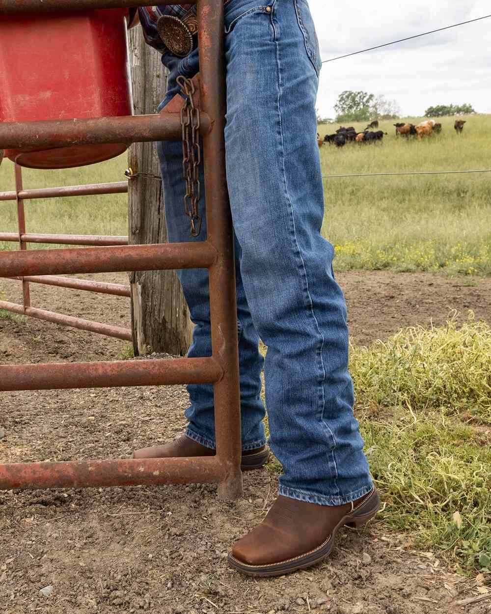 Saddle Brown Denim Blue Coloured Durango Mens DDB0429 Rebel Western Boots on Outdoor Background
