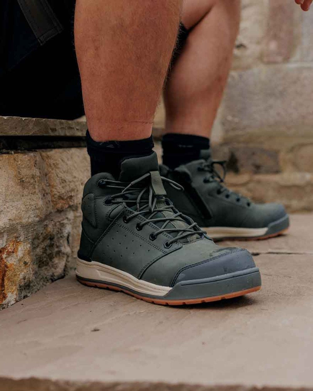 Olive Coloured Hard Yakka  Mens 3056 Lace Zip Safety Boots on Stairs Background
