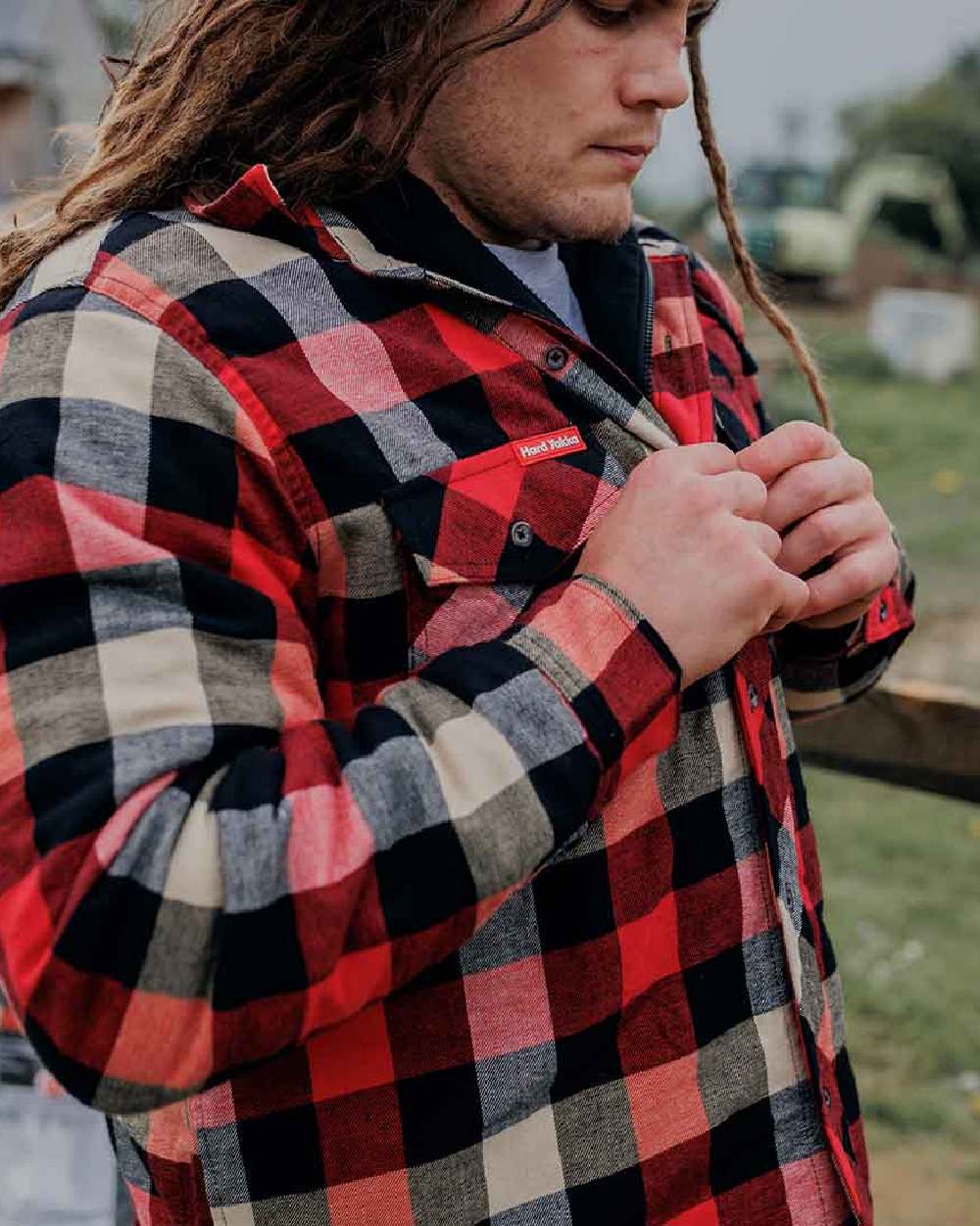 Red Coloured Hard Yakka Mens Quilted Flannel Shacket on Blurry Background
