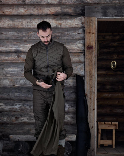 Willow Green Coloured Harkila Logmar Insulated Packable Knee Breeches On A Wooden House Background 