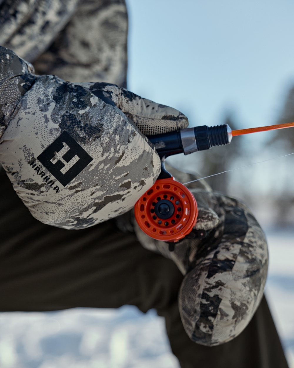 AXIS Mountain Coloured Harkila Mountain Hunter Expedition HWS Down Mittens On A Snow Background