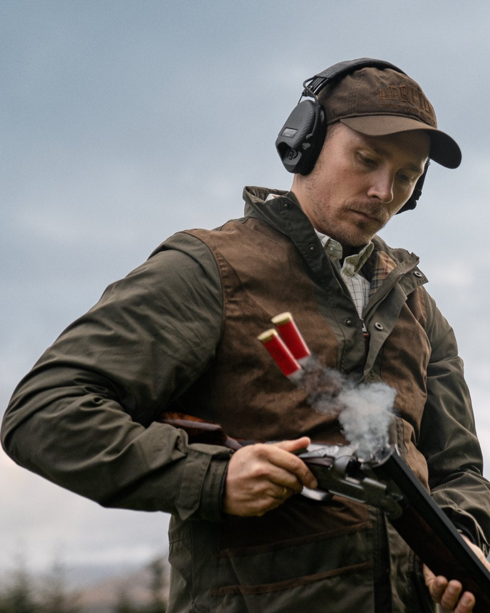 Willow Green Coloured Harkila Rannoch HWS Shooting Jacket On A Forest Background