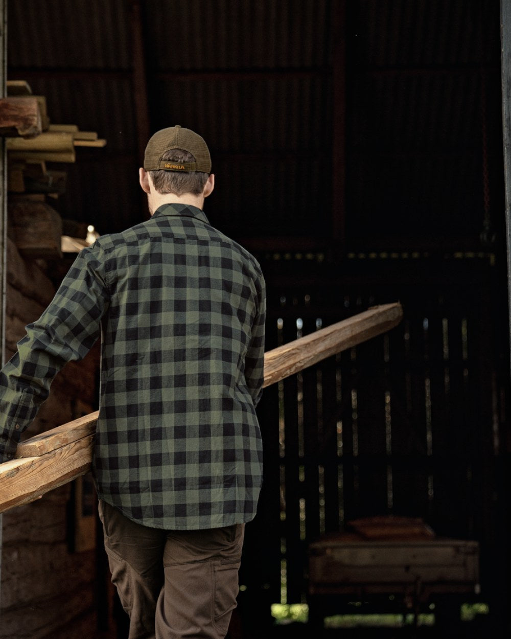 Green Check Coloured Harkila Scandinavian Long Sleeve Shirt On A Backyard Background 