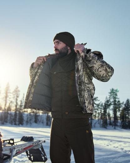 Willow Green Coloured Harkila Trygve Beanie On A Snow Background