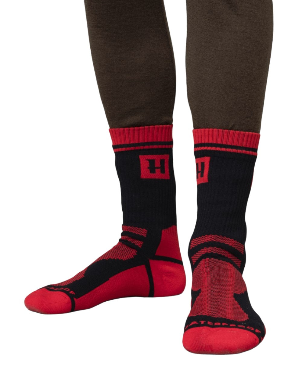 Black Red Coloured Harkila Waterproof Socks On A White Background