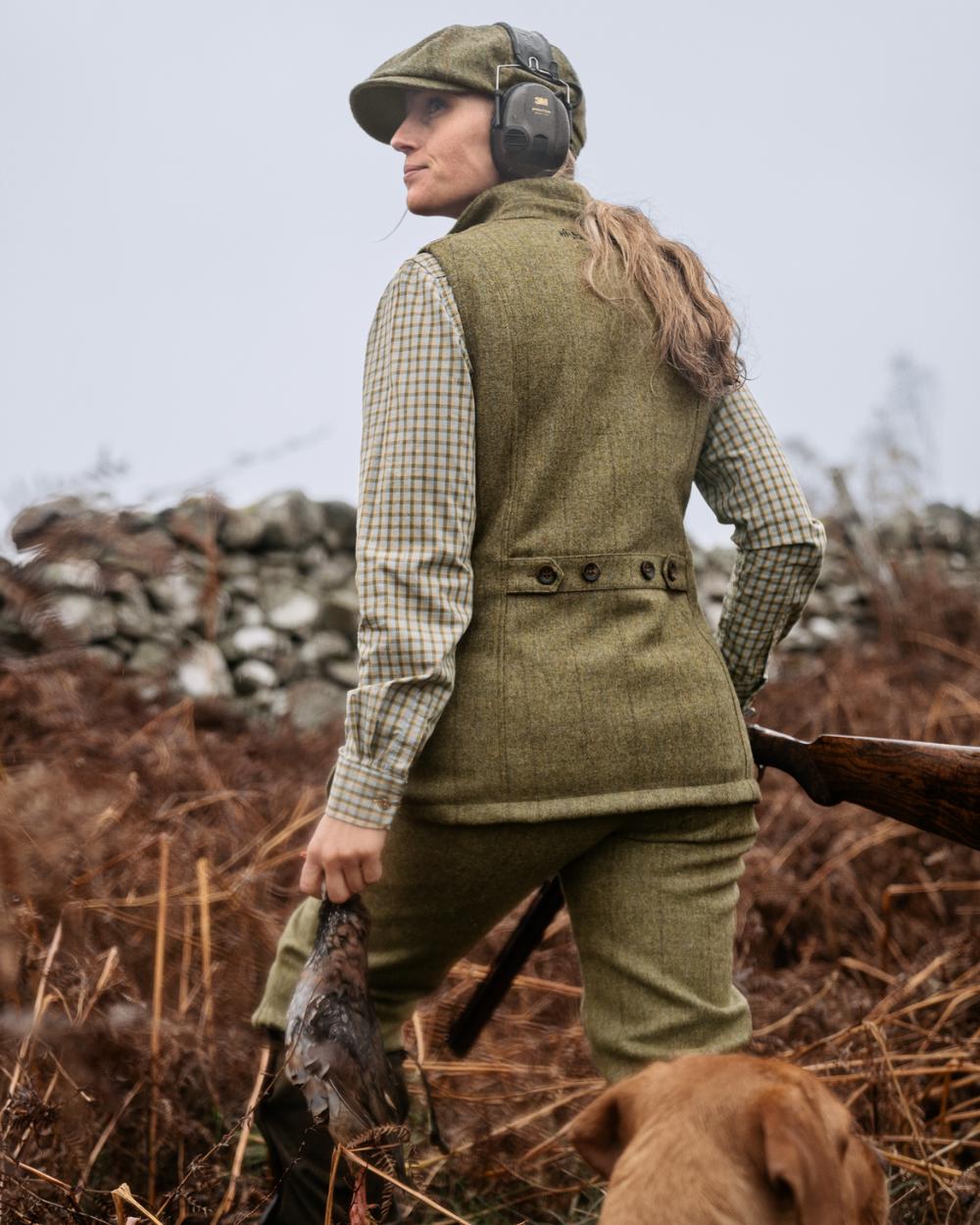 Olive Coloured Harkila Womens Jura Waistcoat On A Forest Background