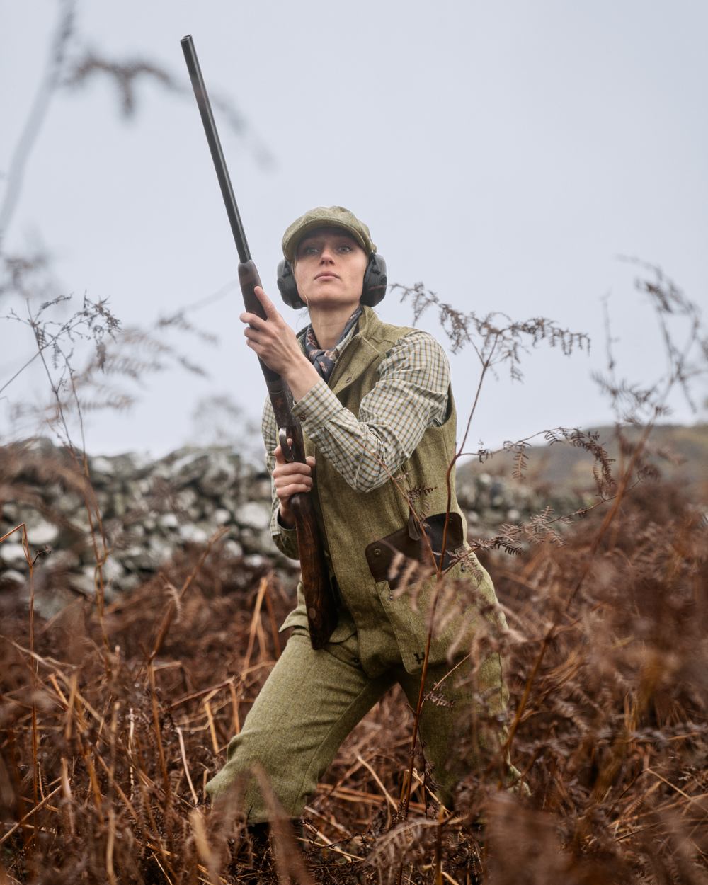 Olive Coloured Harkila Womens Jura Waistcoat On A Forest Background