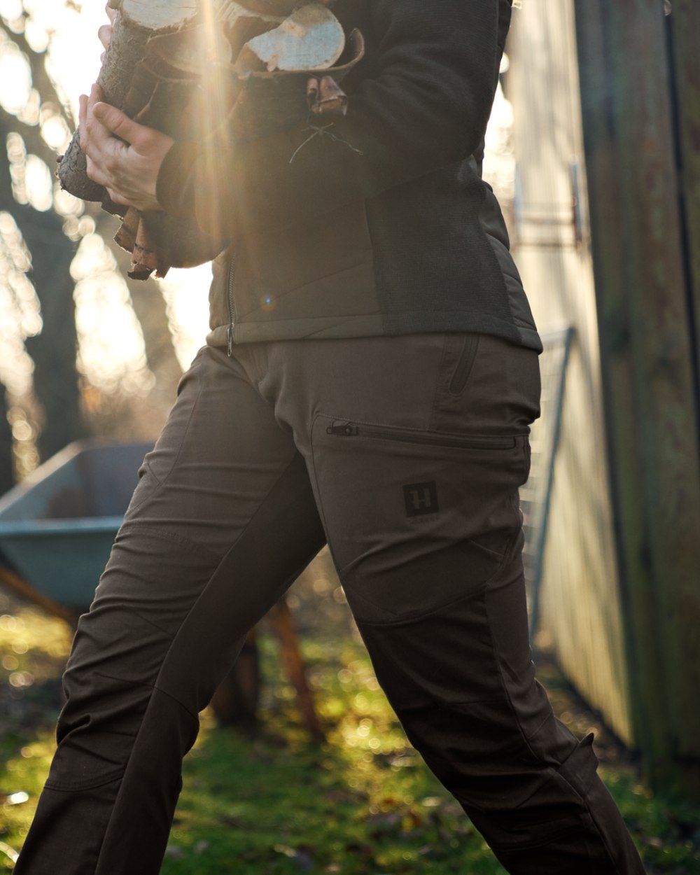 Slate Brown Willow Green Coloured Harkila Womens Runa Pants on outdoor background 
