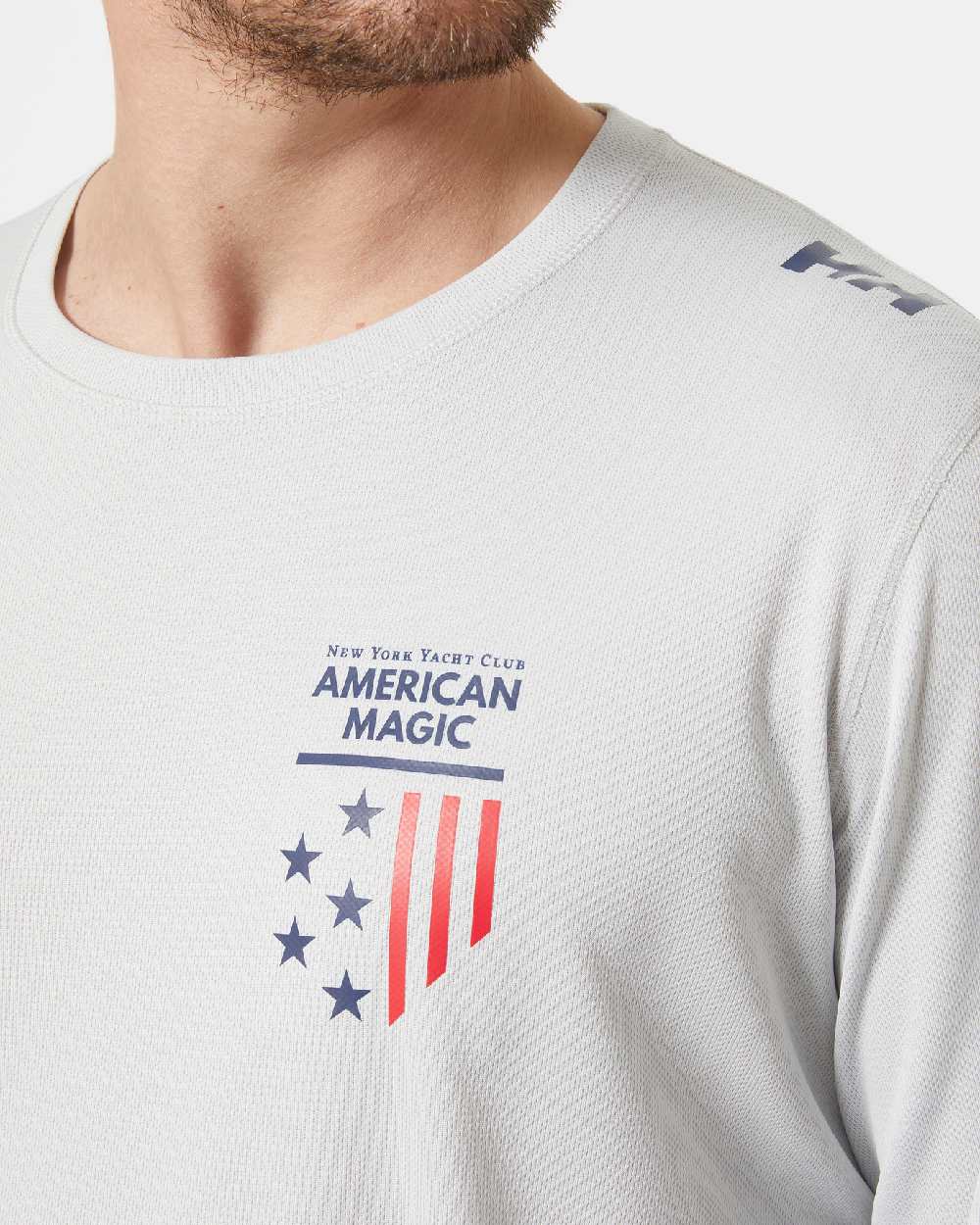 AM Grey Fog coloured Helly Hansen American Magic Technical Crew Long Sleeve Shirt on grey background 