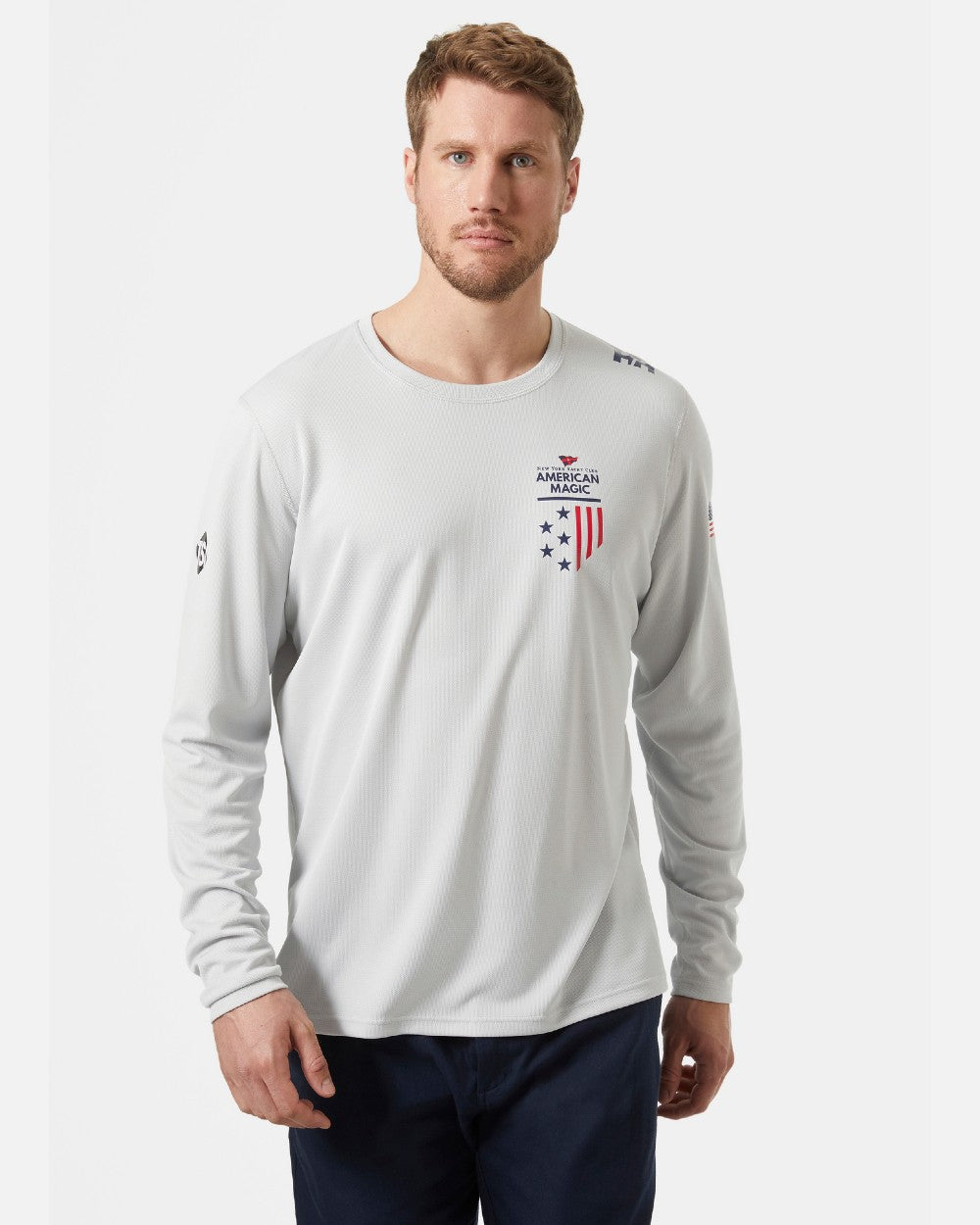 AM Grey Fog coloured Helly Hansen American Magic Technical Crew Long Sleeve Shirt on grey background 