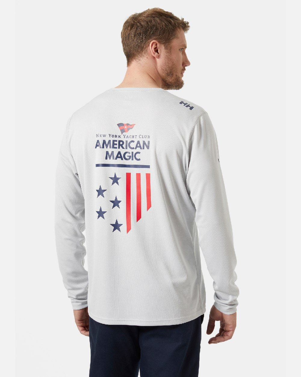 AM Grey Fog coloured Helly Hansen American Magic Technical Crew Long Sleeve Shirt on grey background 