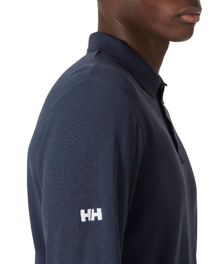 Navy coloured Helly Hansen Mens Crewline Long Sleeves Polo Shirt on white background 