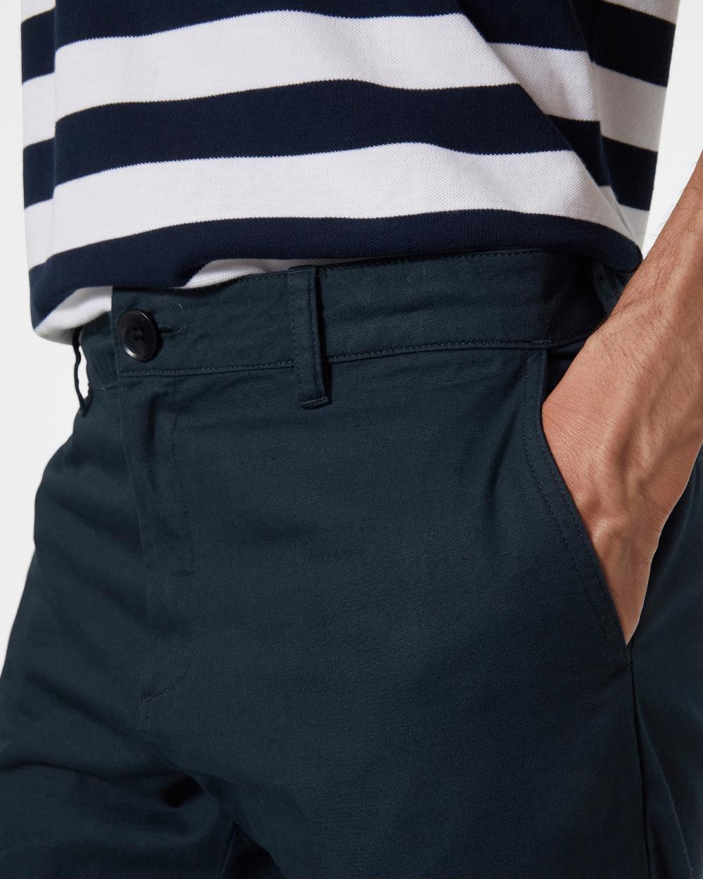 Navy coloured Helly Hansen Mens Dock Chinos on white background 