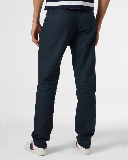 Navy coloured Helly Hansen Mens Dock Chinos on grey background 