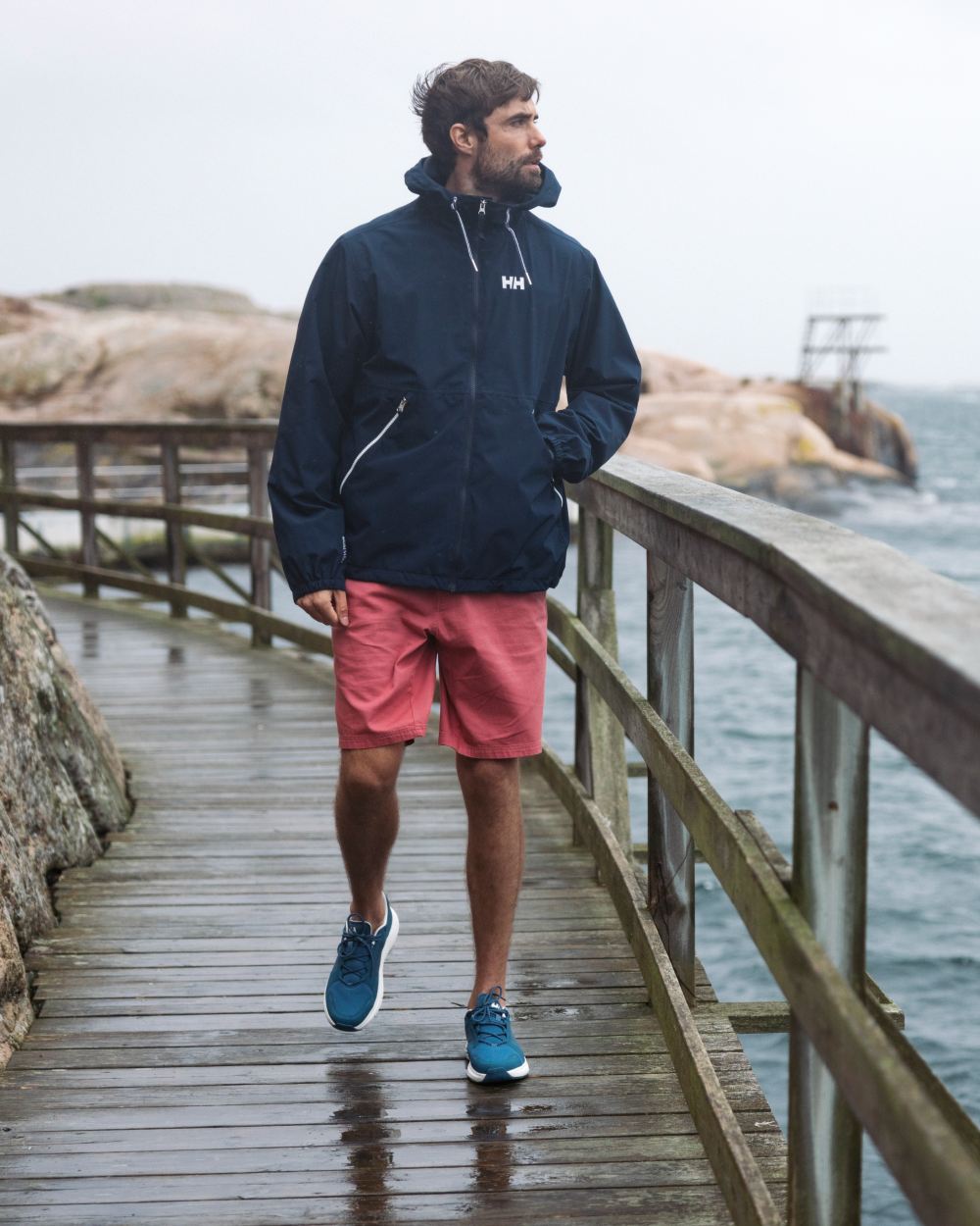 Washed Red Coloured Helly Hansen Mens Dock Shorts on Beach Background
