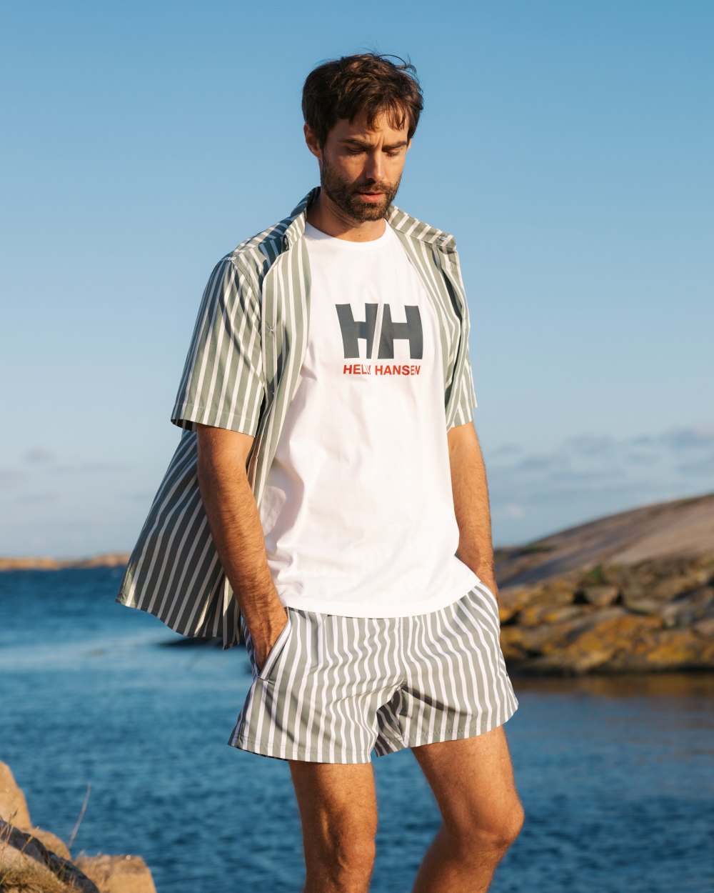 Jungle Green Coloured Helly Hansen Mens Fjord Quick Dry Short Sleeve Shirt 2.0 on Outdoor  Background
