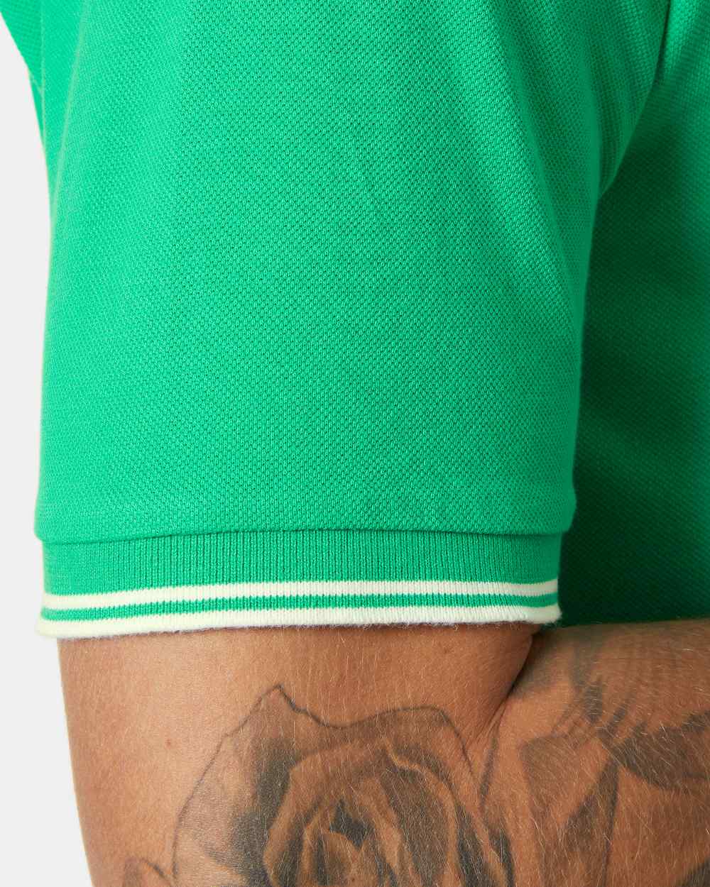 Bright green coloured Helly Hansen Mens Genova Polo T-Shirt on white background 