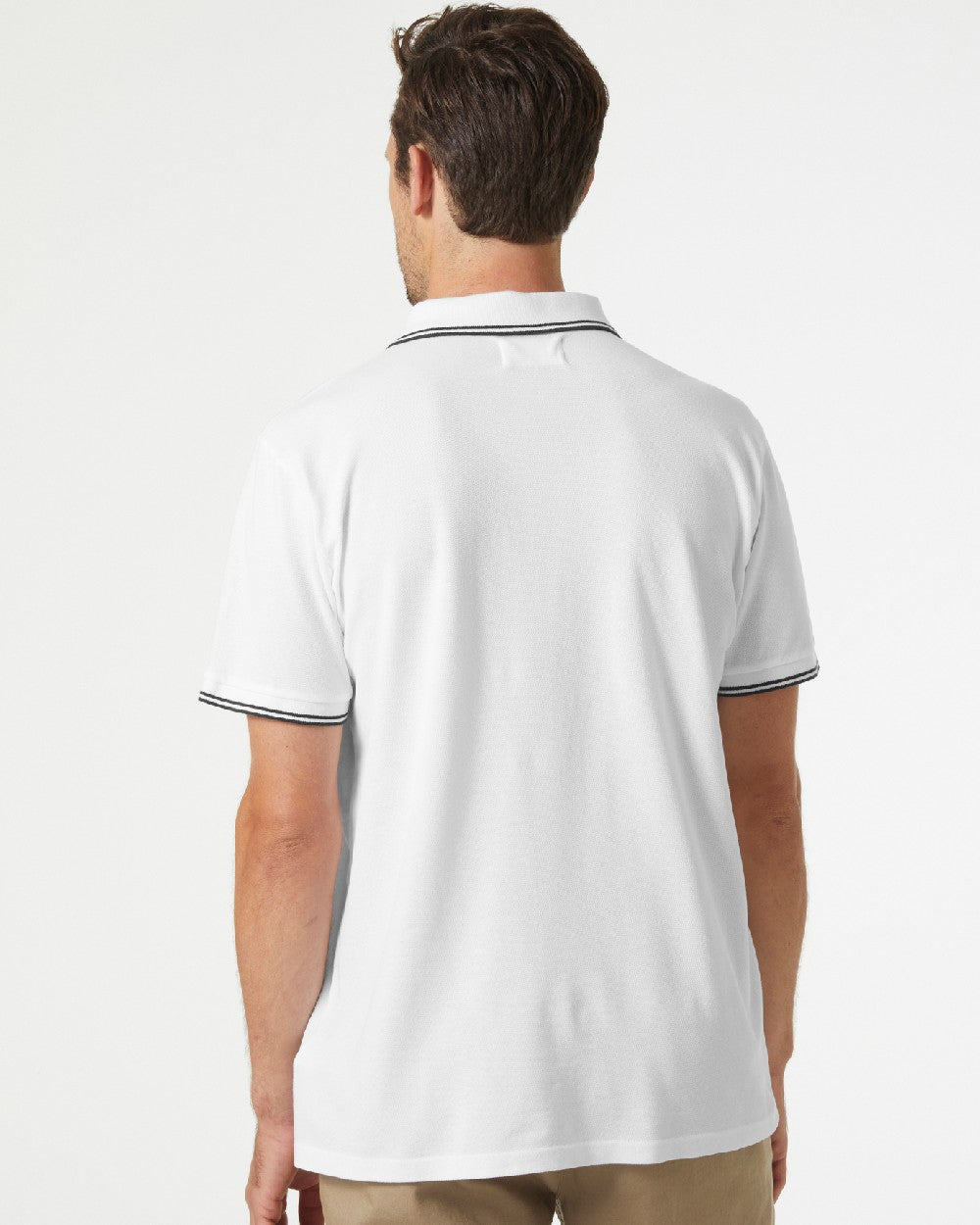 White coloured Helly Hansen Mens Genova Polo T-Shirt on grey background 