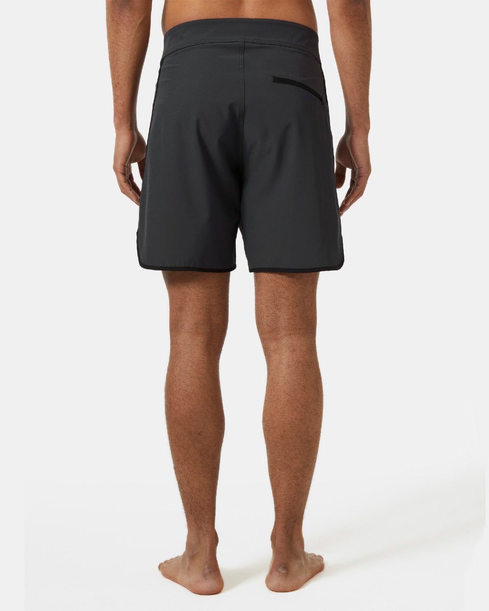 Ebony coloured Helly Hansen Mens HP 7 inch Curve Board Shorts on grey background 