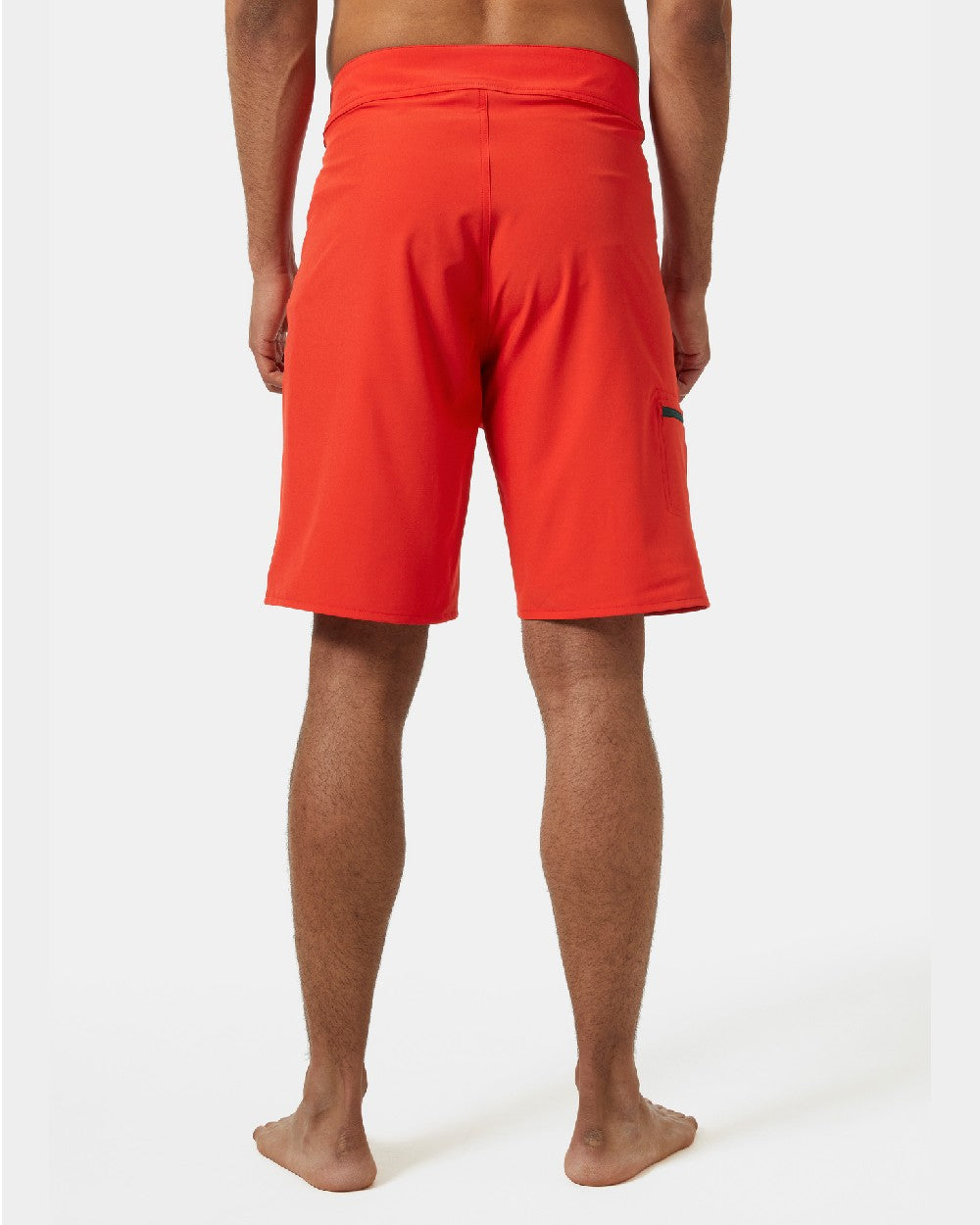 Alert Red Coloured Helly Hansen Mens HP 9 inch Board Shorts 3.0 on grey background 