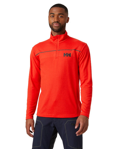 Alert Red coloured Helly Hansen Mens HP Half Zip Pullover Shirt on white background 