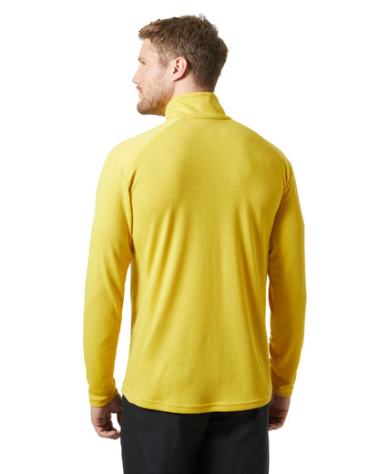 Gold Rush coloured Helly Hansen Mens HP Half Zip Pullover Shirt on white background 