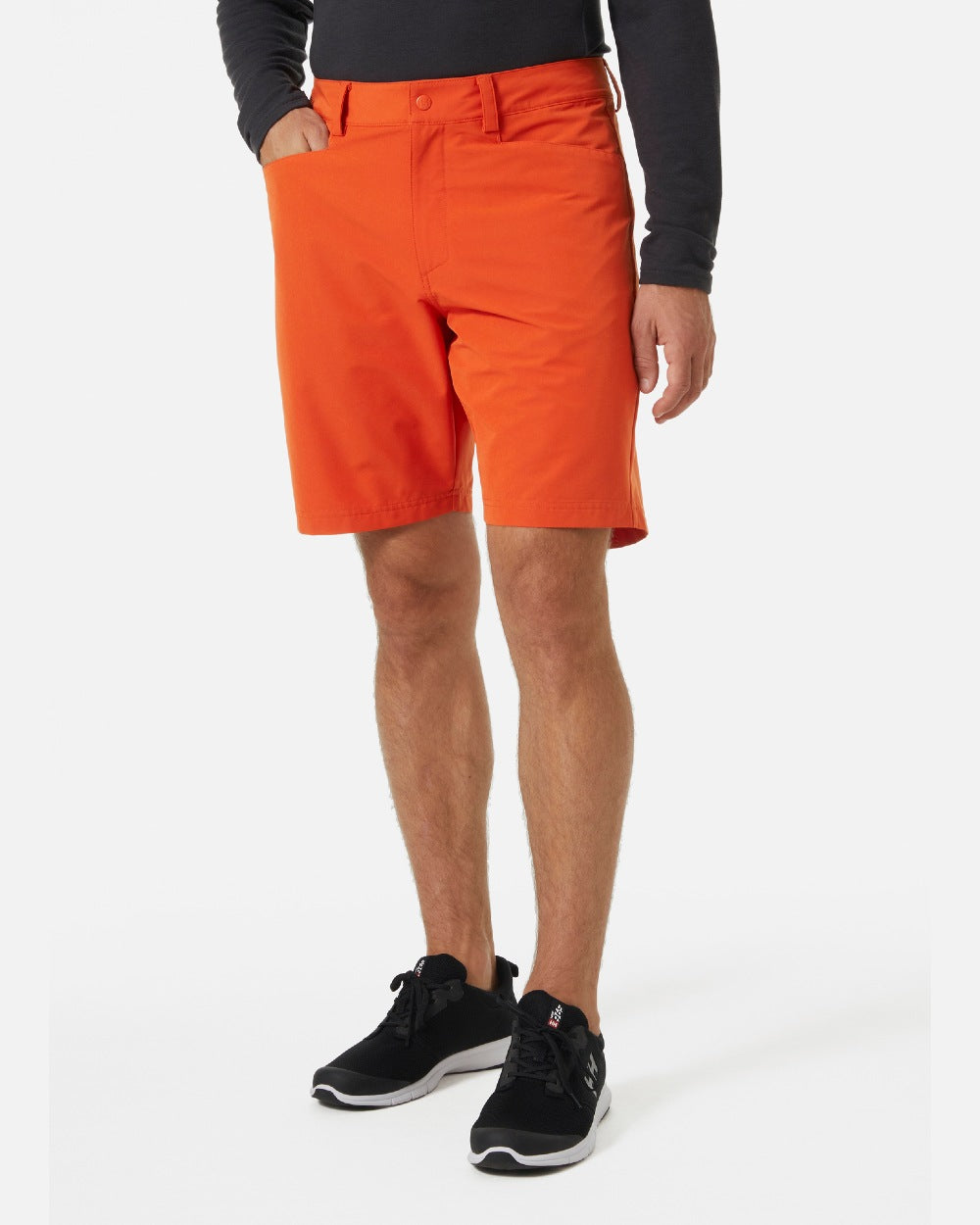 Patrol Orange coloured Helly Hansen Mens HP Quick Dry 10 inch Club Shorts 2.0 on grey background 