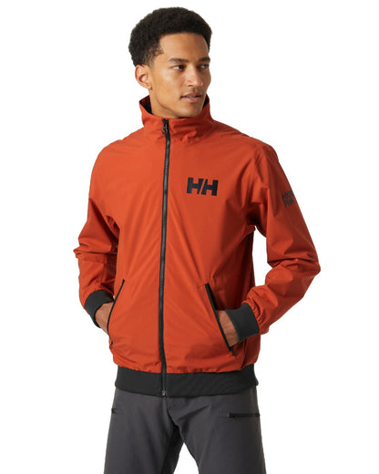 Canyon coloured Helly Hansen Mens HP Racing Bomber Sailing Jacket 2.0 on white background 