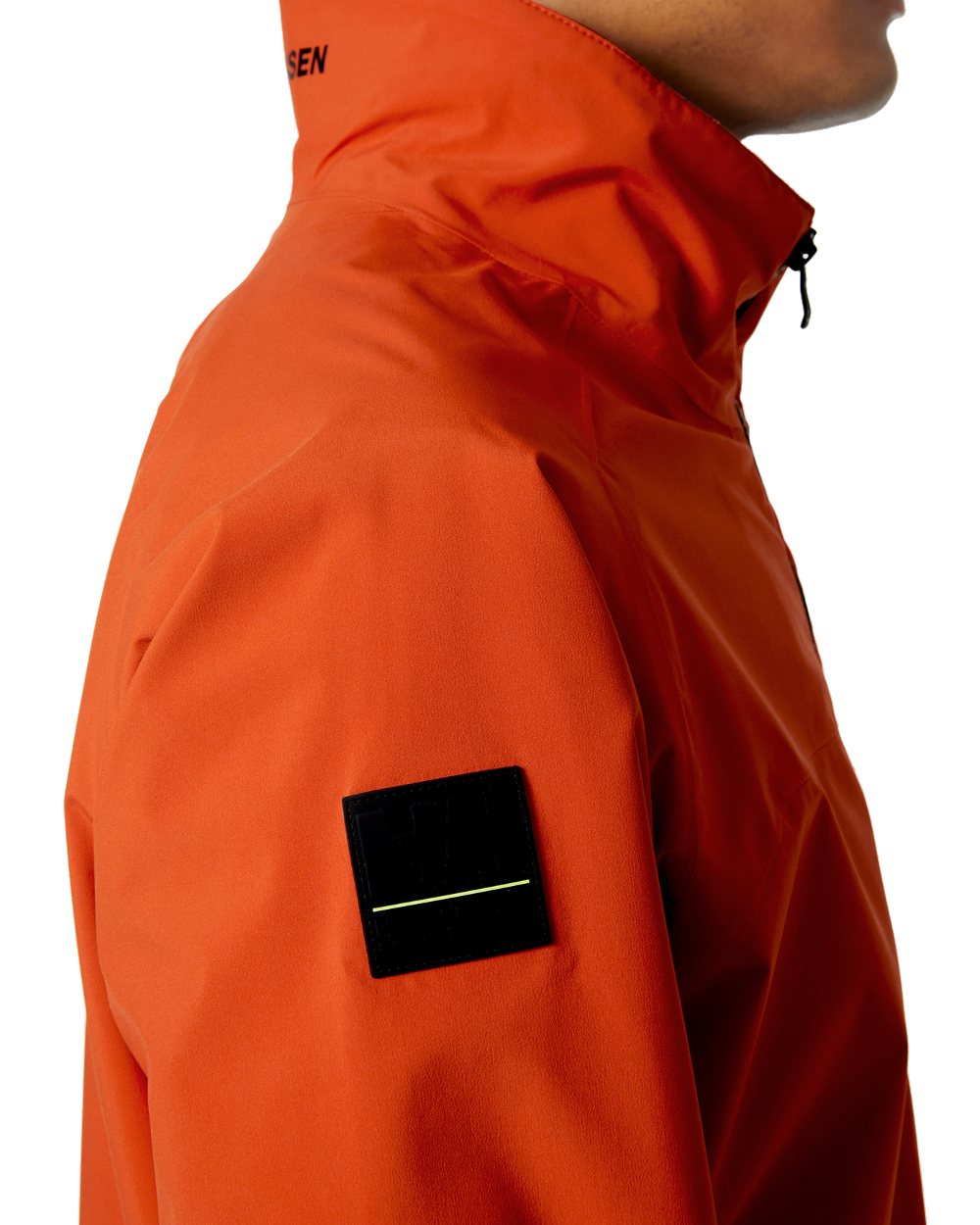 Patrol Orange coloured Helly Hansen Mens HP Racing Sailing Jacket on white background 