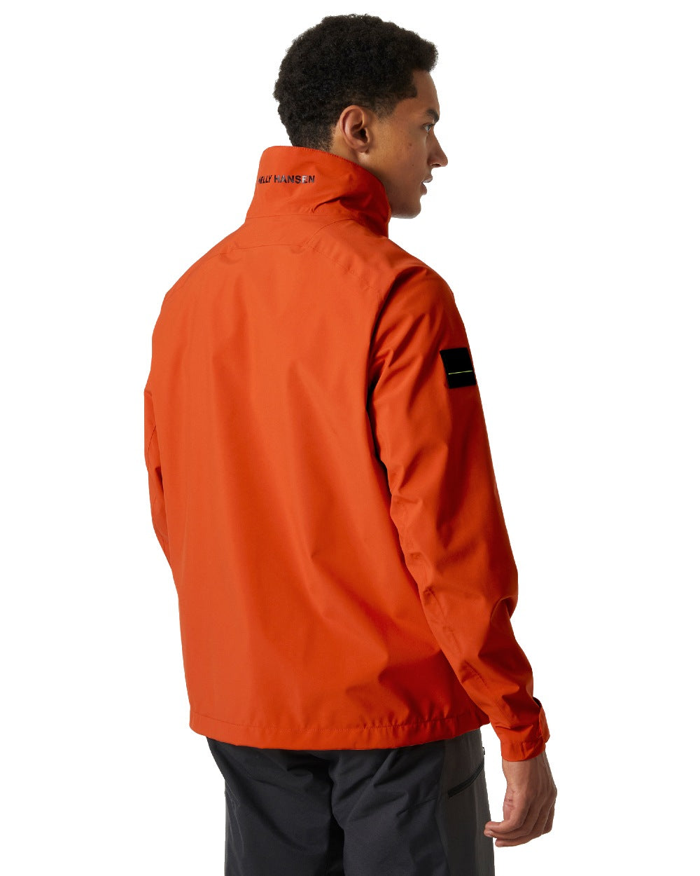Patrol Orange coloured Helly Hansen Mens HP Racing Sailing Jacket on white background 
