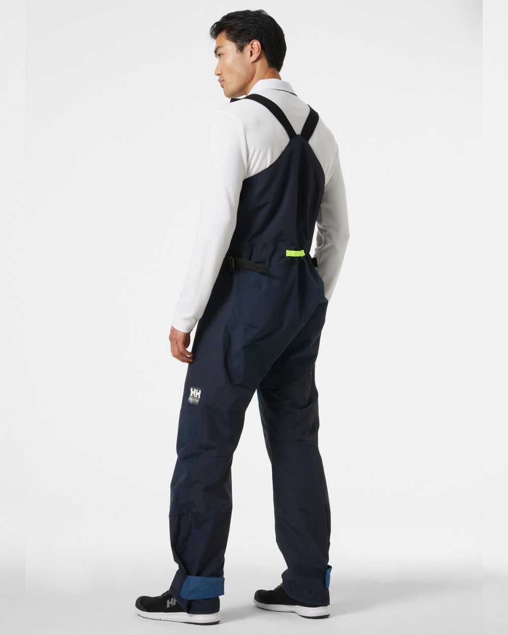 Navy coloured Helly Hansen Mens Newport Coastal Sailing Bib on grey background 