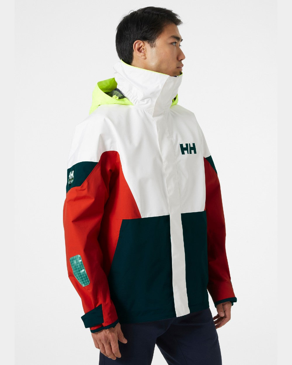 Alert Red coloured Helly Hansen Mens Newport Regatta Jacket on grey background 