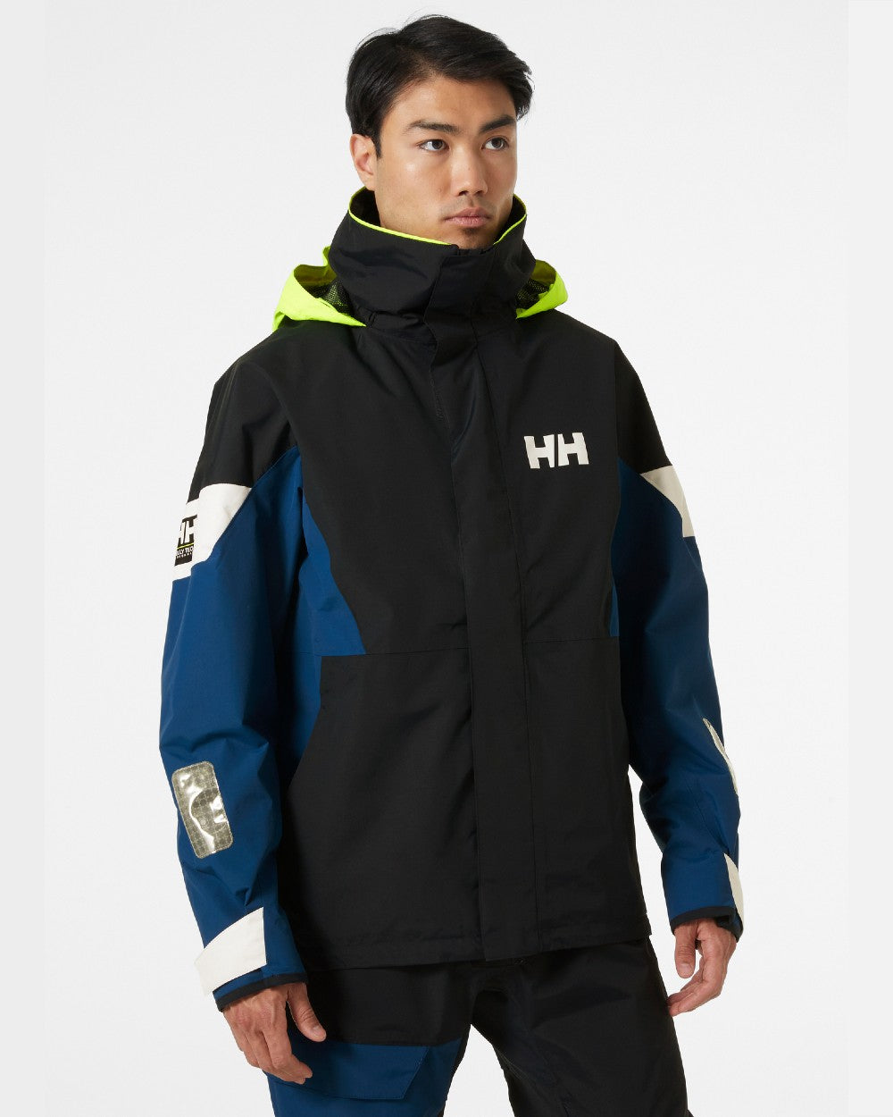 Navy coloured Helly Hansen Mens Newport Regatta Jacket on grey background 