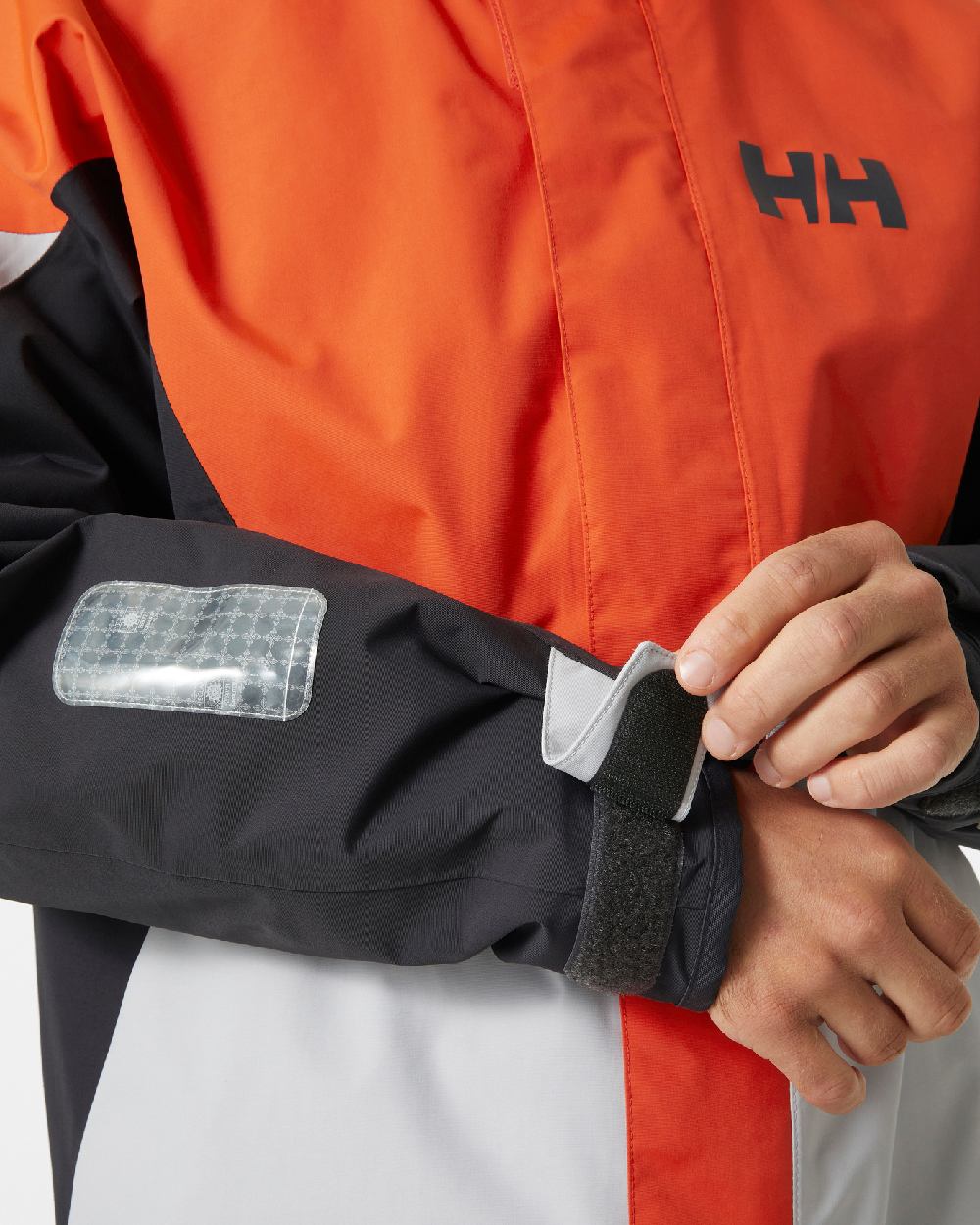 Patrol Orange coloured Helly Hansen Mens Newport Regatta Jacket on white background 