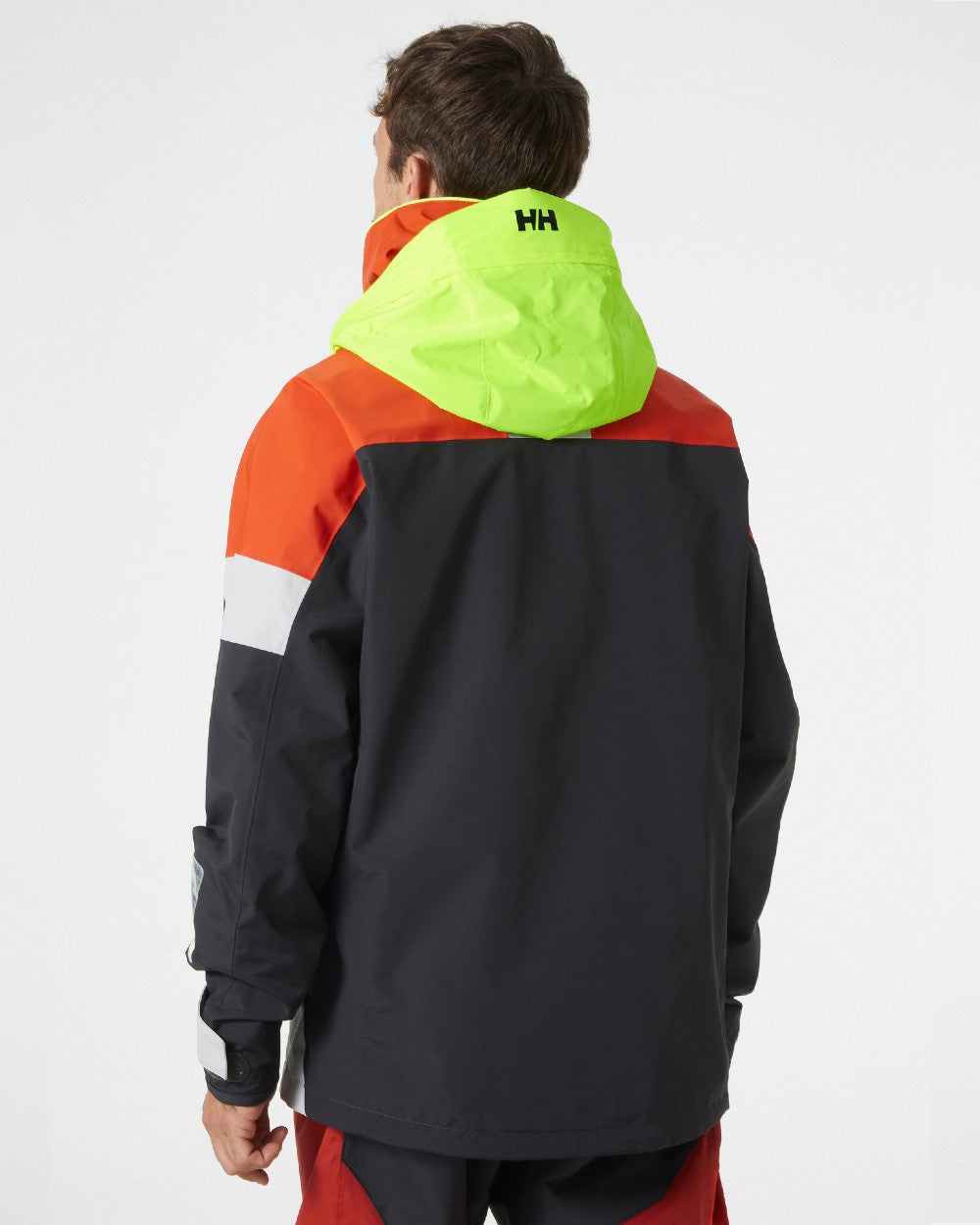 Patrol Orange coloured Helly Hansen Mens Newport Regatta Jacket on grey background 