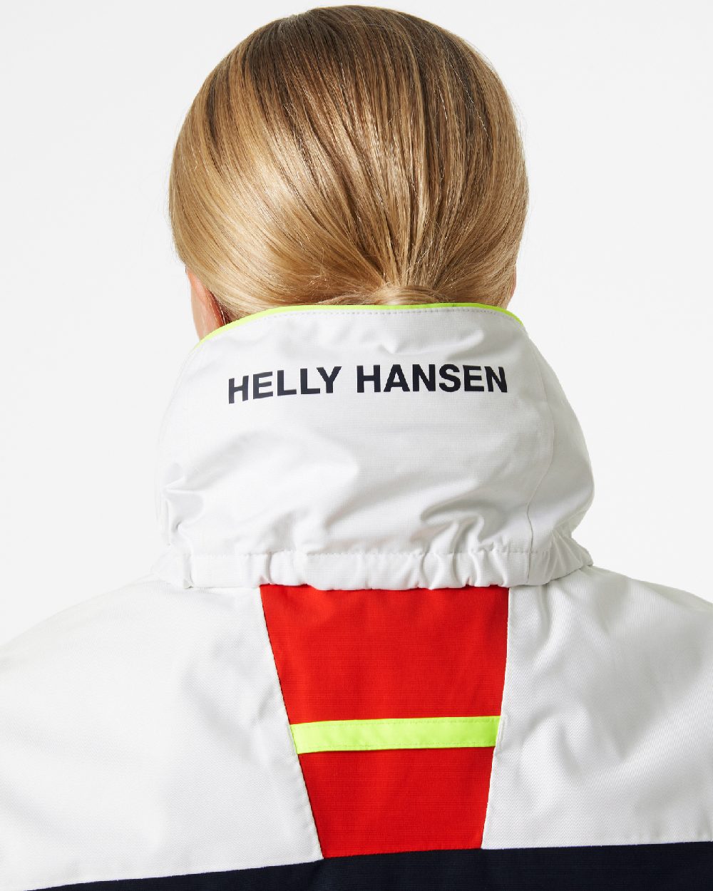 Alert Red coloured Helly Hansen Womens Newport Coastal Jacket on grey background 