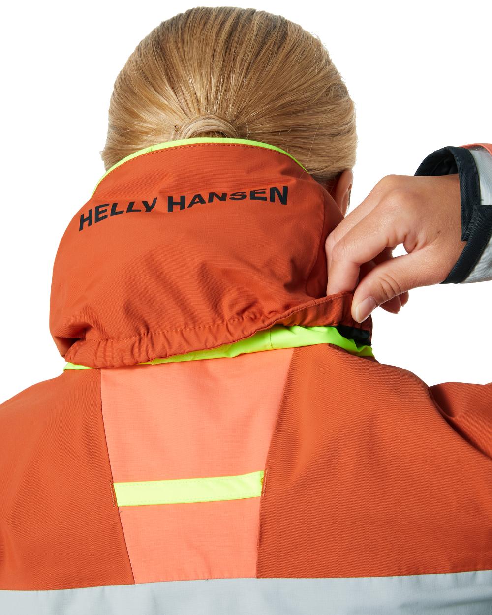 Terracotta coloured Helly Hansen Womens Newport Coastal Jacket on white background 