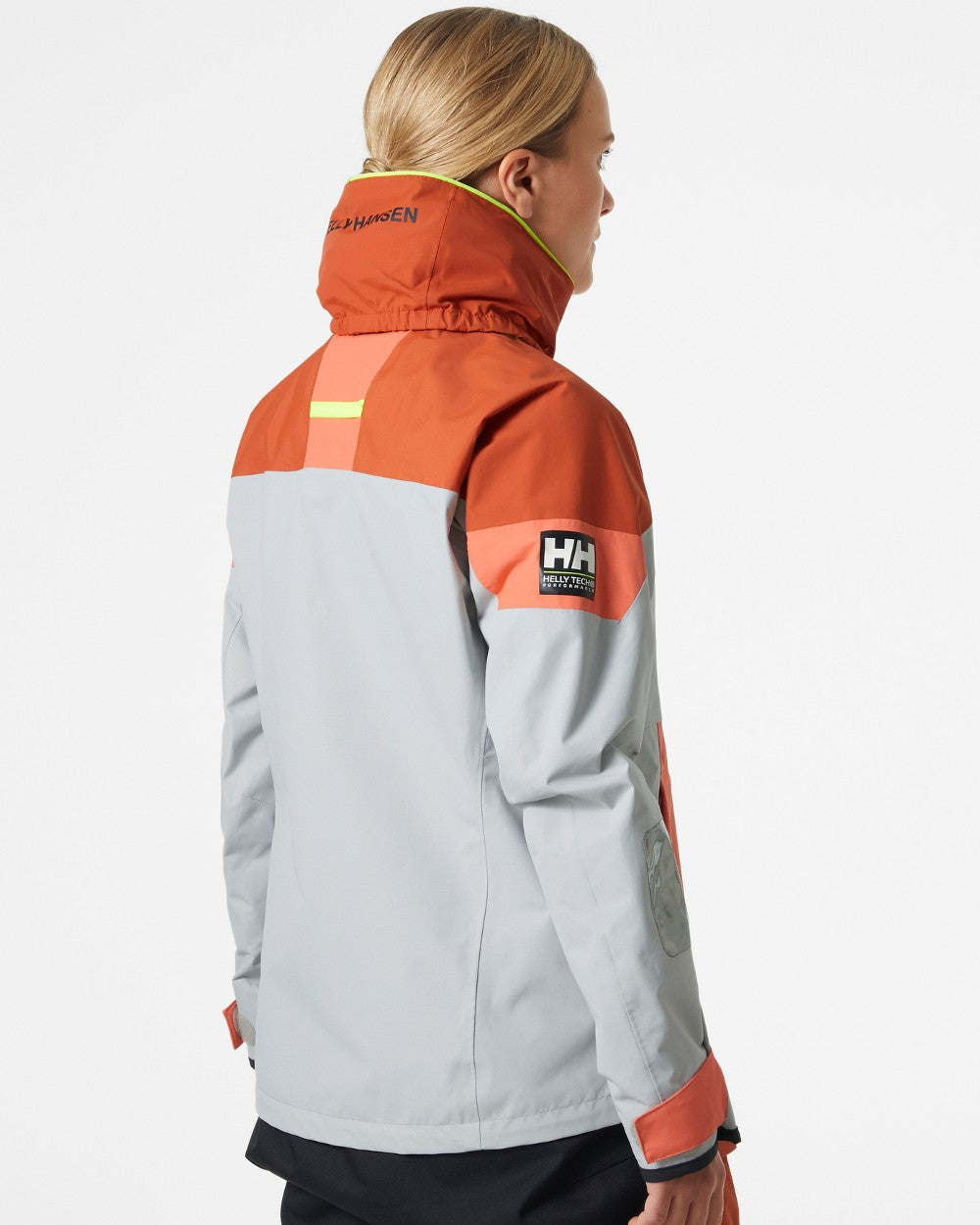 Terracotta coloured Helly Hansen Womens Newport Coastal Jacket on grey background 