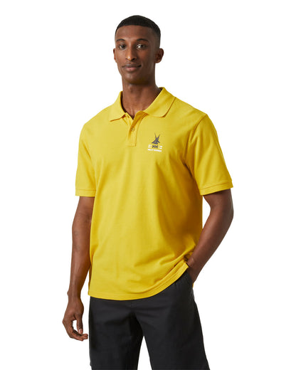 Gold Rush coloured Helly Hansen Polo Shirt on White background 