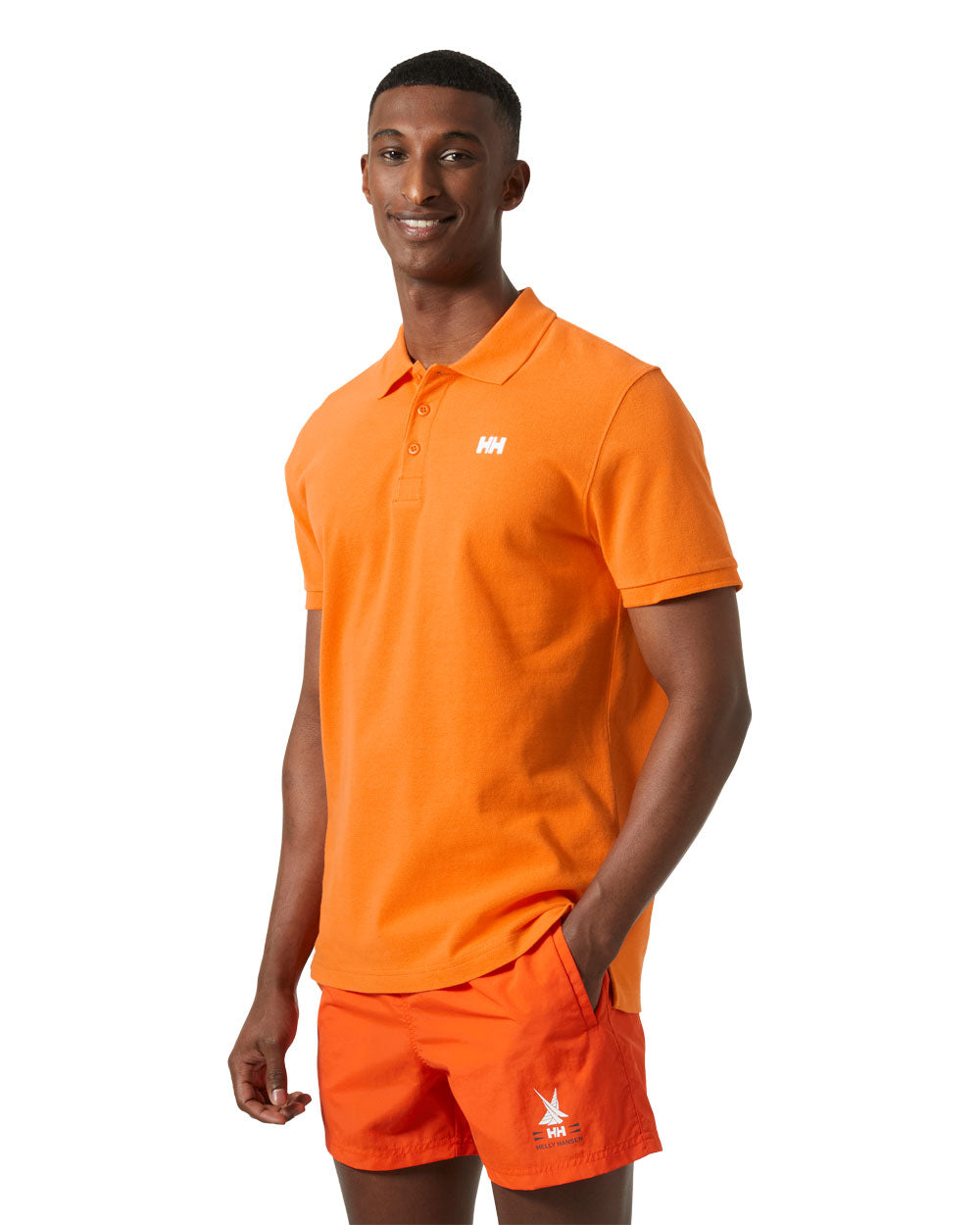 Poppy Orange coloured Helly Hansen Polo Shirt on White background 