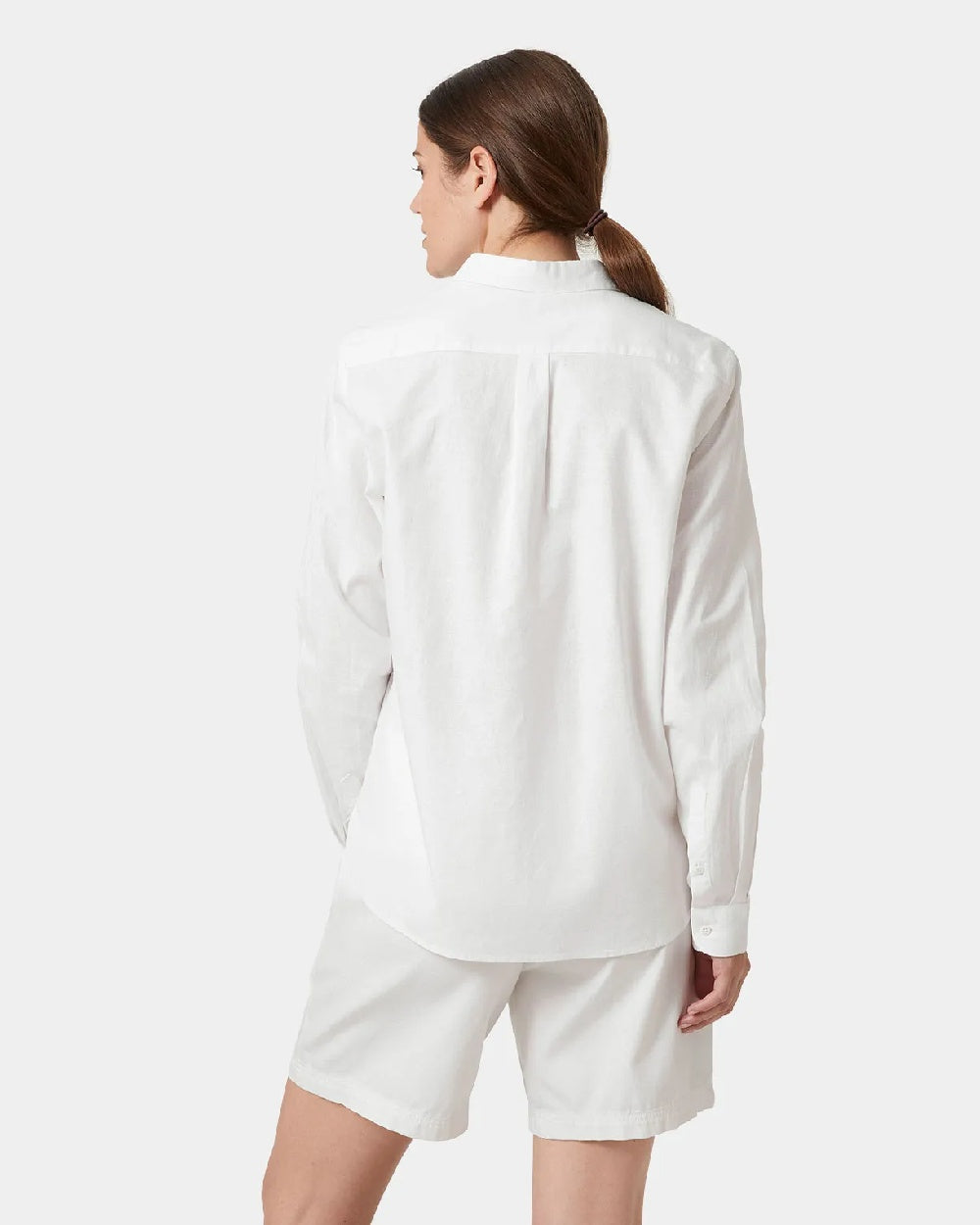 White coloured Helly Hansen Womens Club Shirt on grey background 