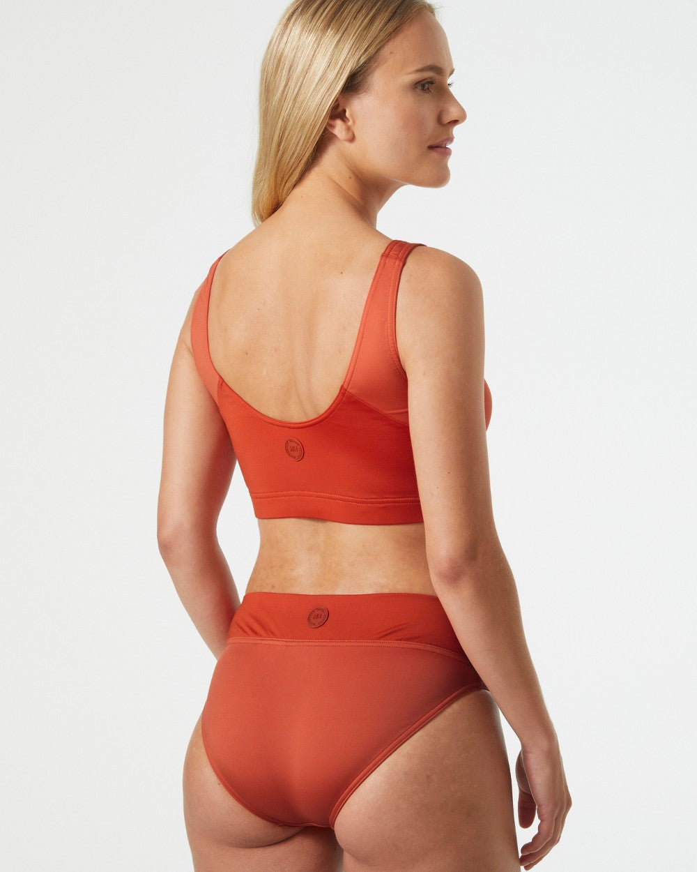 Terracotta coloured Helly Hansen Womens HP Bikini Bottom on grey background 