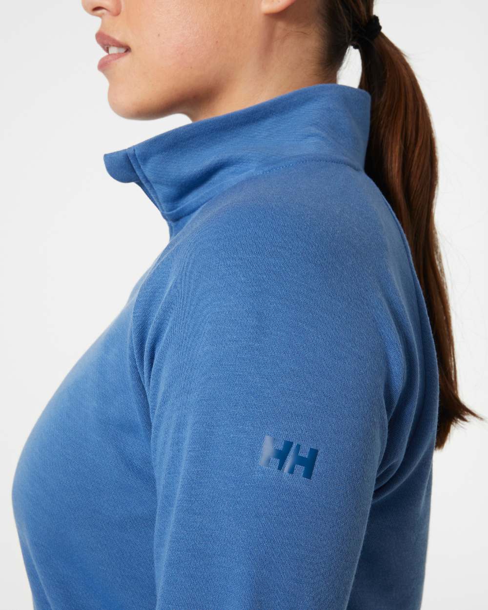 Azurite coloured Helly Hansen Womens Inshore Half Zip Pullover on grey background 