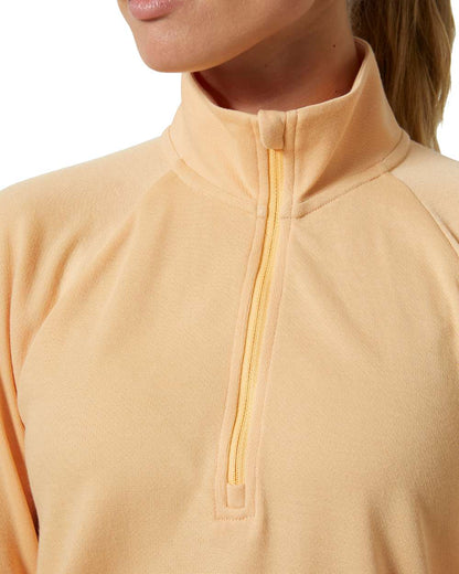 Miami Peach coloured Helly Hansen Womens Inshore Half Zip Pullover on white background 