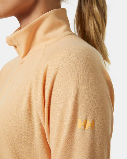 Miami Peach coloured Helly Hansen Womens Inshore Half Zip Pullover on grey background 