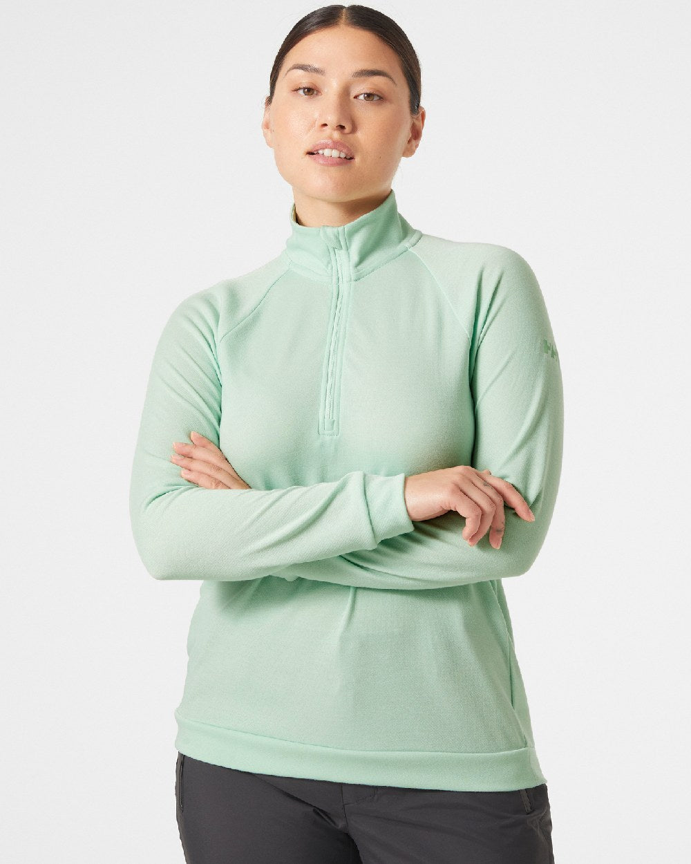 Mint coloured Helly Hansen Womens Inshore Half Zip Pullover on grey background 