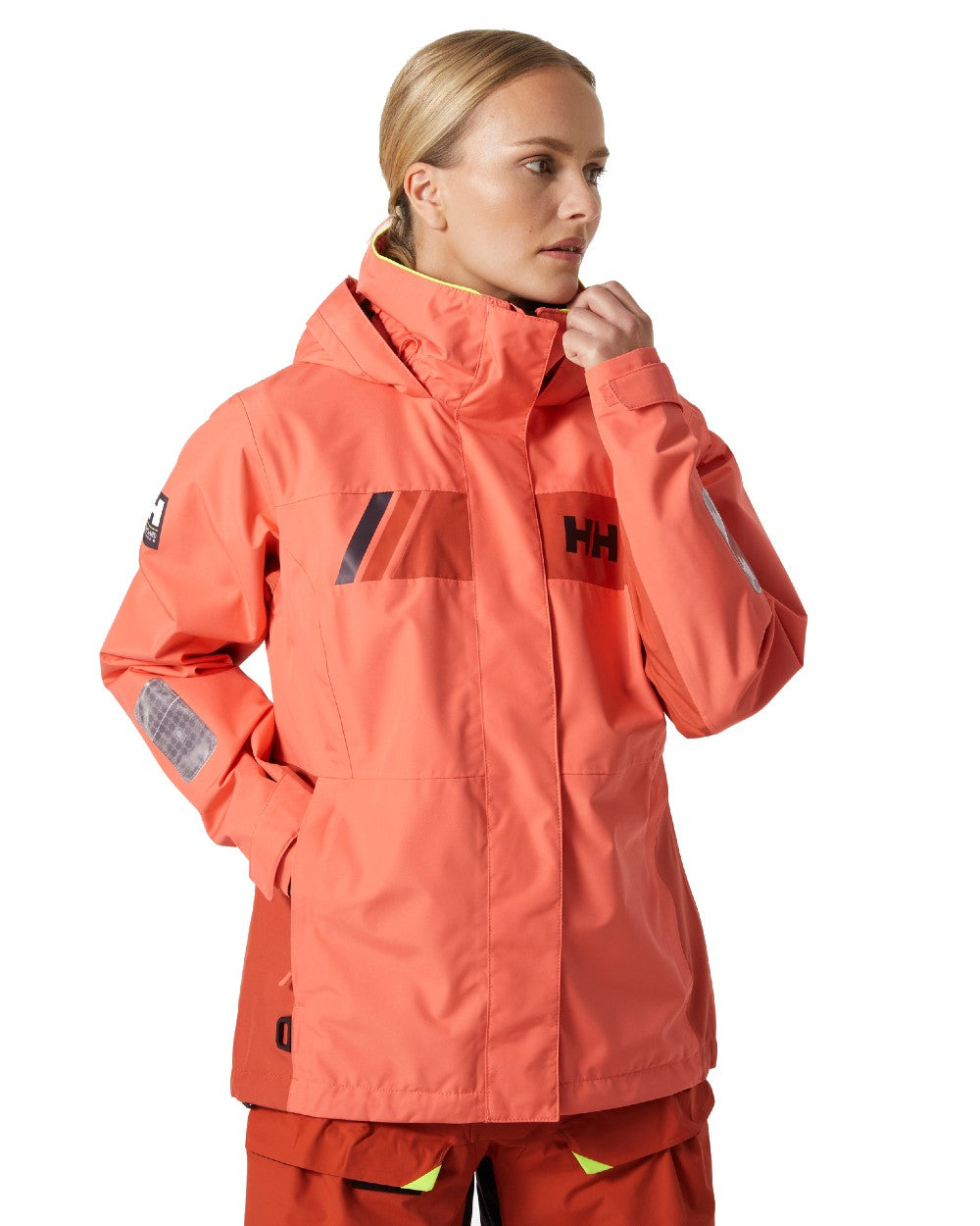 Peach Echo coloured Helly Hansen Womens Newport Inshore Sailing Jacket on white background 