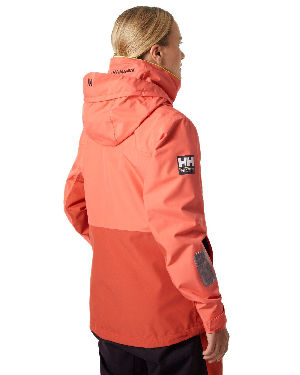 Peach Echo coloured Helly Hansen Womens Newport Inshore Sailing Jacket on white background 