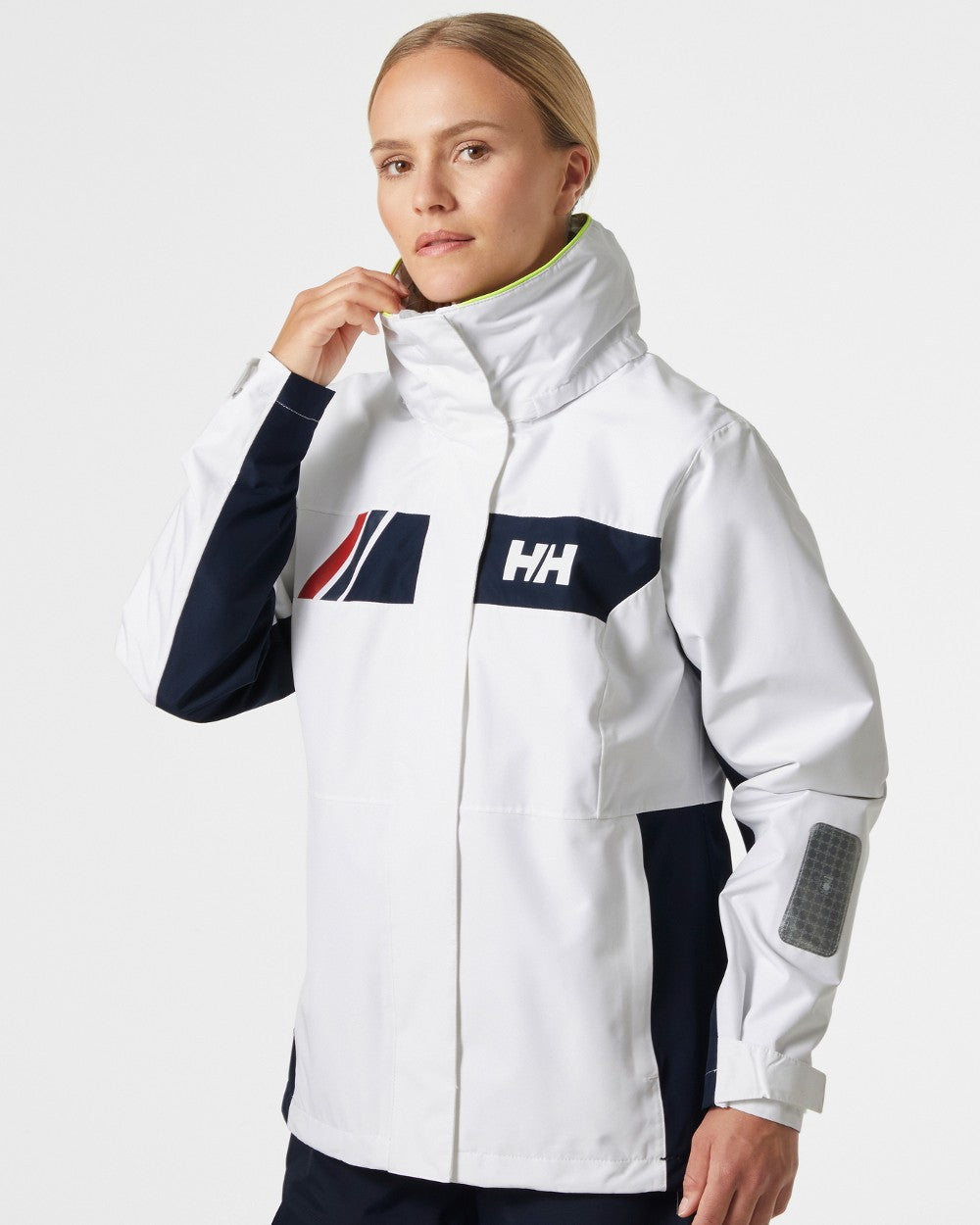 White coloured Helly Hansen Womens Newport Inshore Sailing Jacket on grey background 
