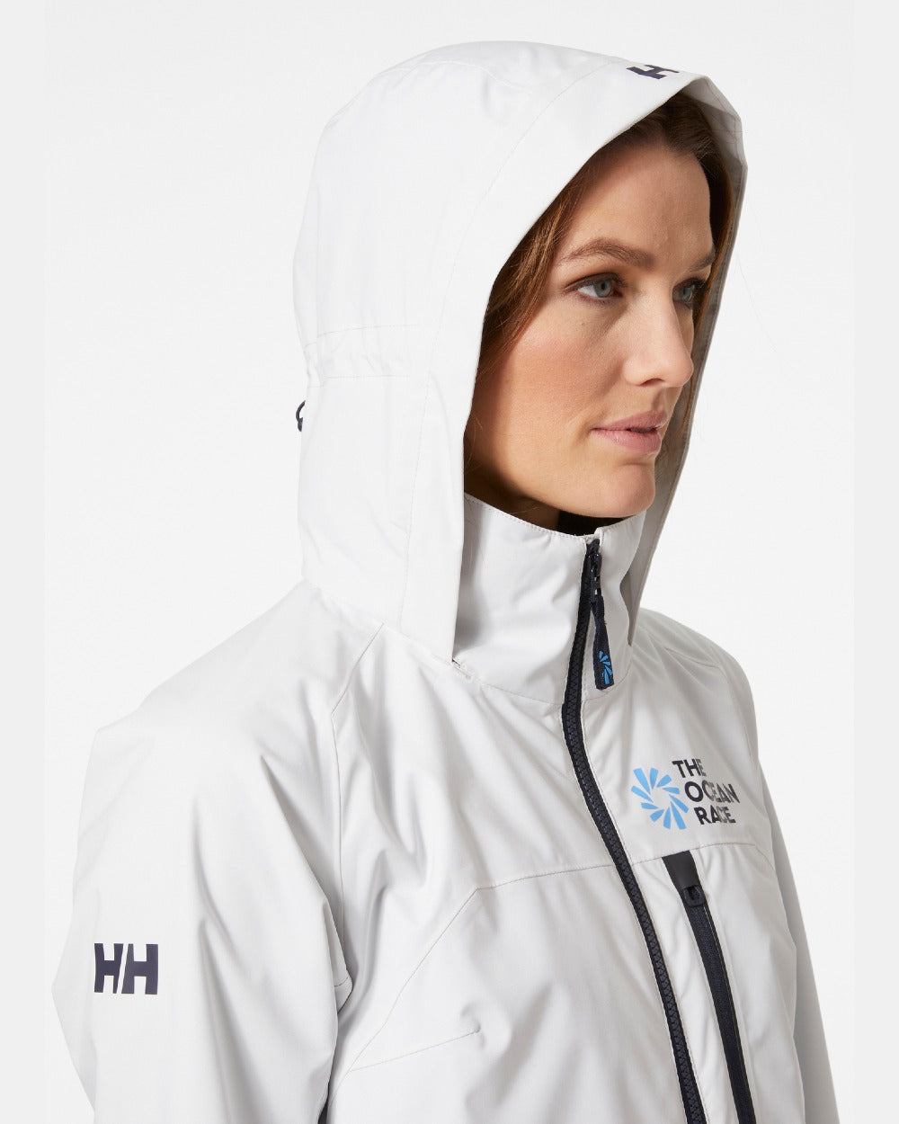 Nimbus Cloud coloured Helly Hansen Womens Ocean Race Long Sailing Coat on grey background 